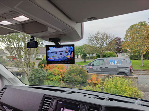 Image showing our ceiling mount bracket holding a reversing camera display on the ceiling of a van